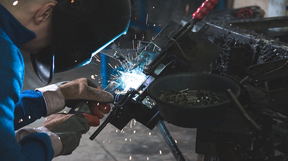 image of man welding metal